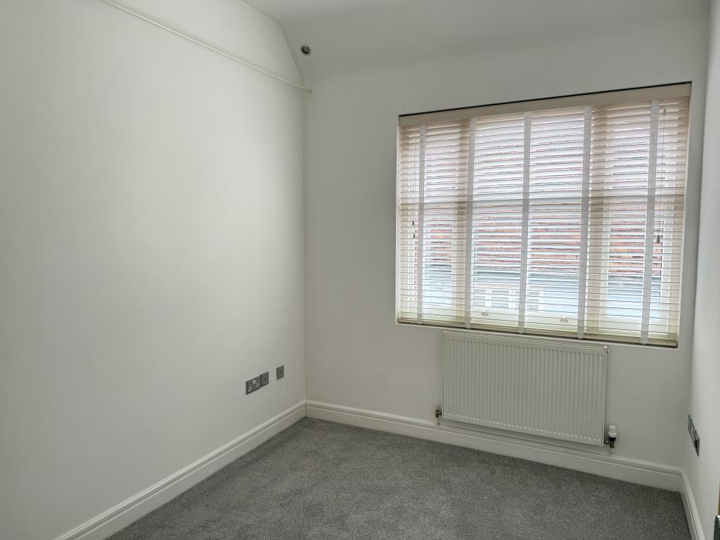Lot: 139 - ONE-BEDROOM FLAT FOR INVESTMENT OR OCCUPATION - Bedroom with white walls and grey carpet